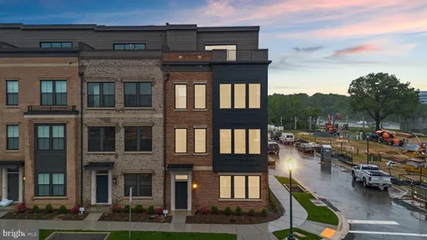 a city view with tall buildings and a cars park