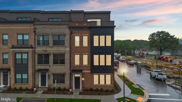 a city view with tall buildings and a cars park