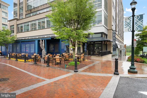 a view of a building with sitting area