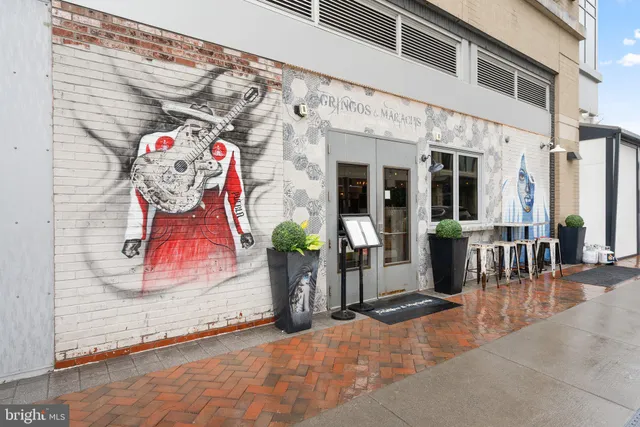 an entryway of a house with wooden floor