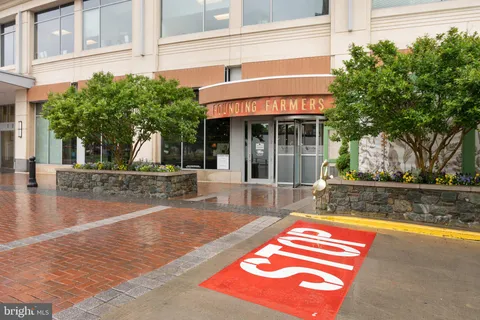 a view of a house with a swimming pool and sitting area