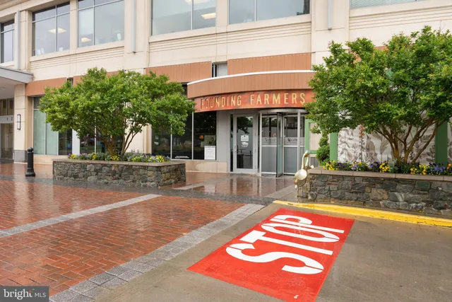 a view of a house with a swimming pool and sitting area