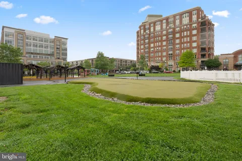 a view of building with outdoor space and swimming pool