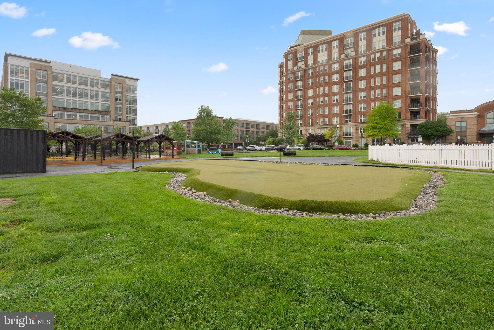 1121 Polaris Road Potomac, MD 20854 - Photo 46 of 51 a view of building with outdoor space and swimming pool