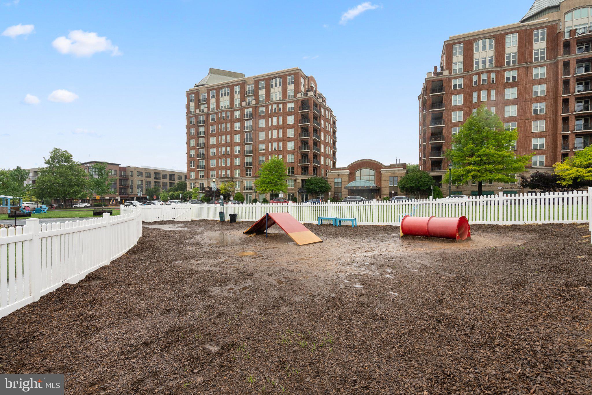 1121 Polaris Road Potomac, MD 20854 - Photo 47 of 51 a view of tall buildings and a yard