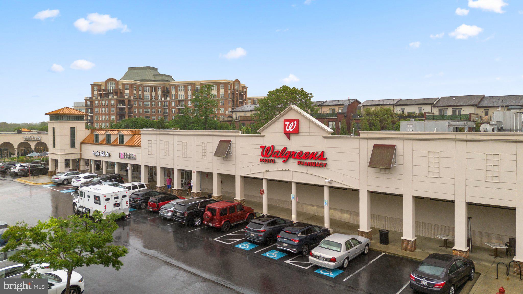 1121 Polaris Road Potomac, MD 20854 - Photo 50 of 51 a front view of a building with cars parked