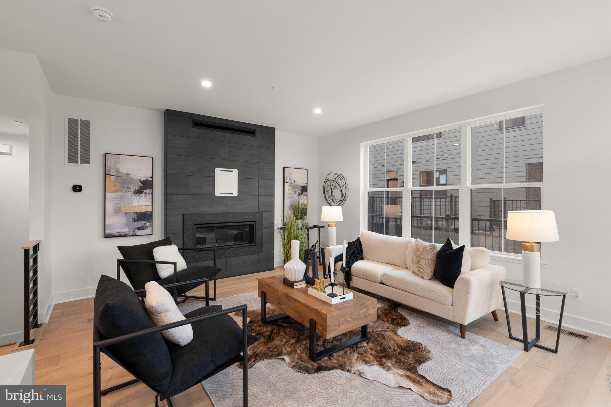 1121 Polaris Road Potomac, MD 20854 - Photo 6 of 51 a living room with furniture and a large window