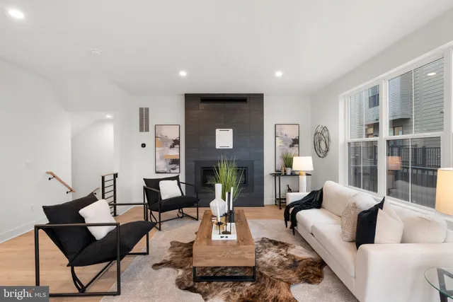 a living room with furniture and a table