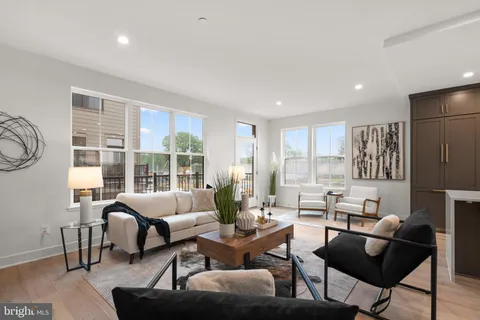 a living room with furniture and a table