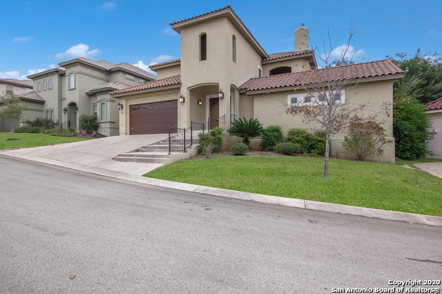 137 Stone Hill Drive San Antonio, TX 78258 - Photo 1 of 1 a front view of a house with a yard