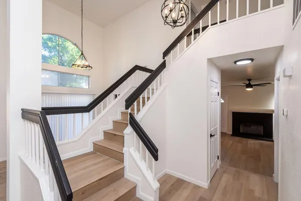 a view of entryway and hall with wooden floor