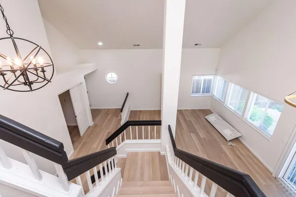a view of an entryway with wooden floor