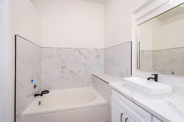 a bathroom with a sink and a bathtub