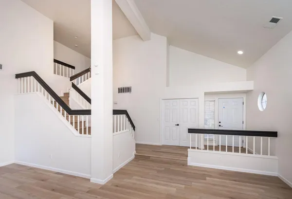 a view of an entryway with wooden floor