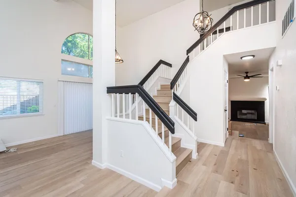 a view of entryway and hall with wooden floor