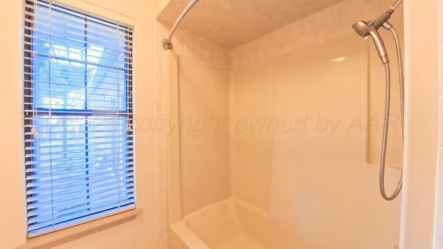 a bathroom with a double vanity sink mirror and toilet