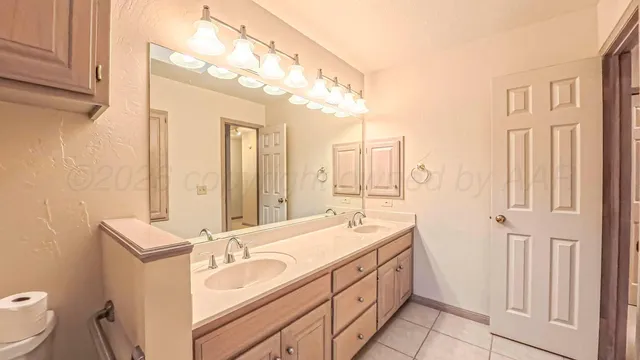 en empty room with windows and fan