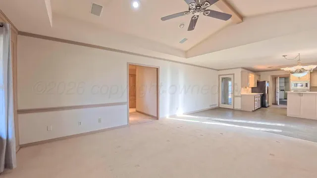 a large kitchen with cabinets and stainless steel appliances