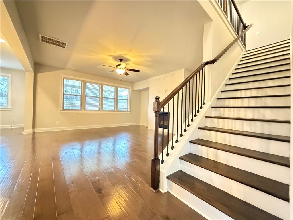 1545 Dahlia Drive Cumming, GA 30040 - Photo 11 of 50 a view of an entryway with wooden floor and door
