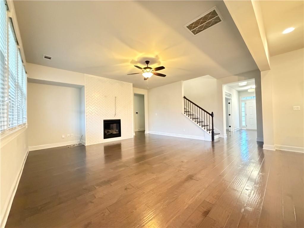 1545 Dahlia Drive Cumming, GA 30040 - Photo 13 of 50 a view of an empty room with a fireplace