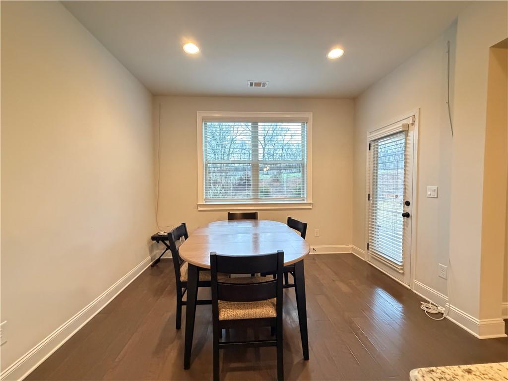1545 Dahlia Drive Cumming, GA 30040 - Photo 18 of 50 a dining room with furniture and window