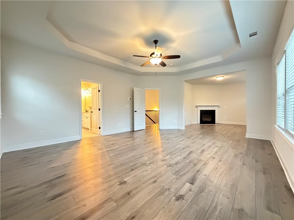 1545 Dahlia Drive Cumming, GA 30040 - Photo 28 of 50 a view of an empty room and window with wooden floor