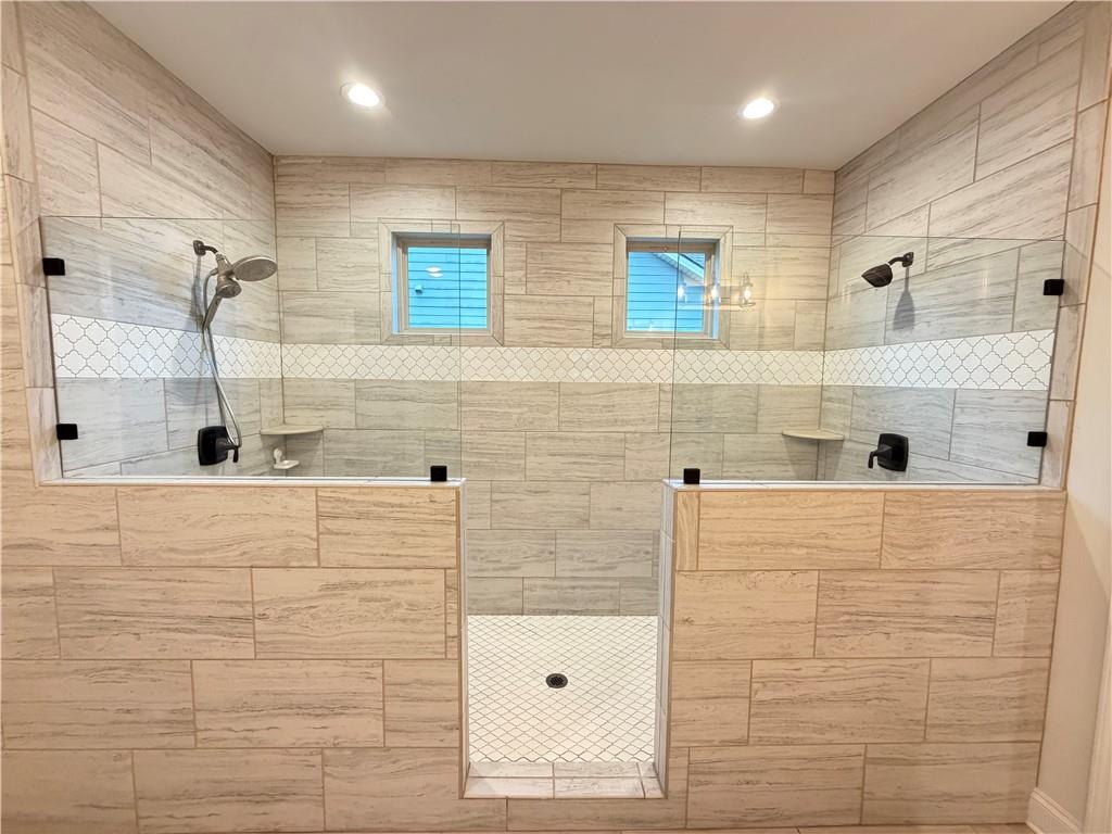 1545 Dahlia Drive Cumming, GA 30040 - Photo 34 of 50 a bathroom with a shower