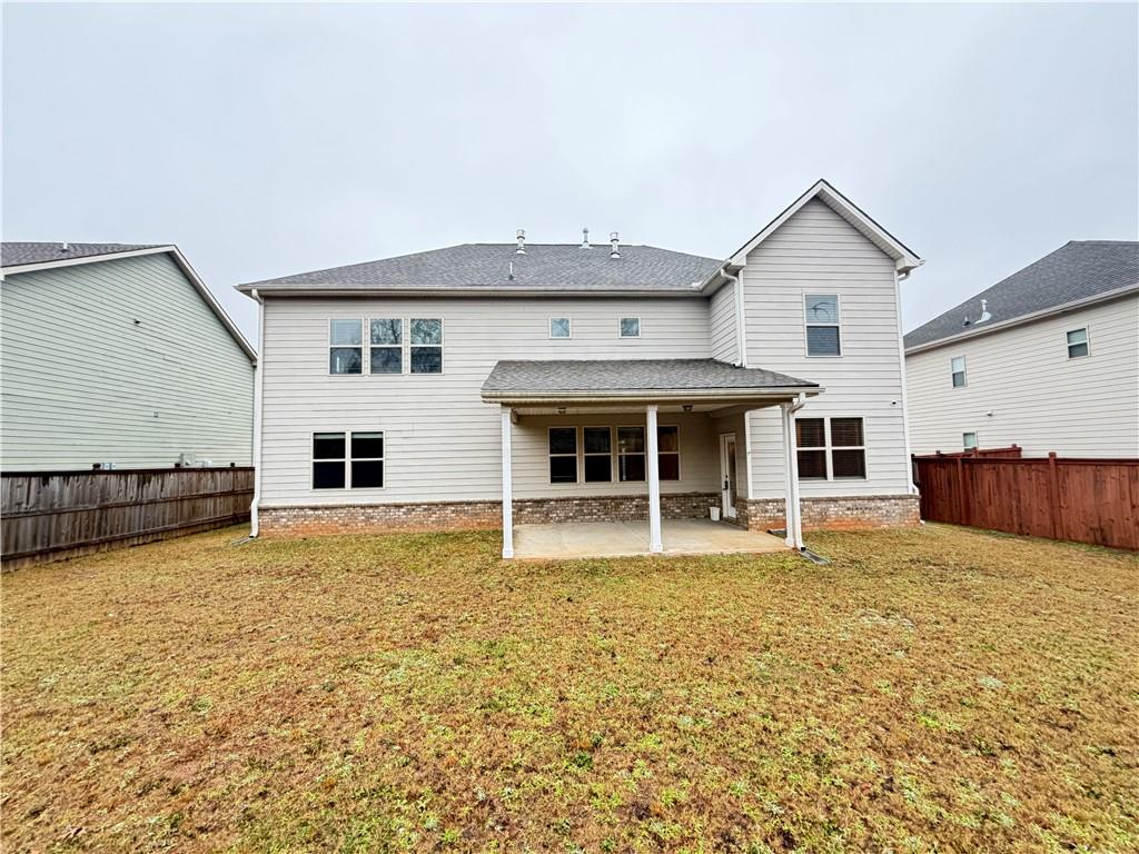 1545 Dahlia Drive Cumming, GA 30040 - Photo 48 of 50 a view of a house with a yard and sitting area