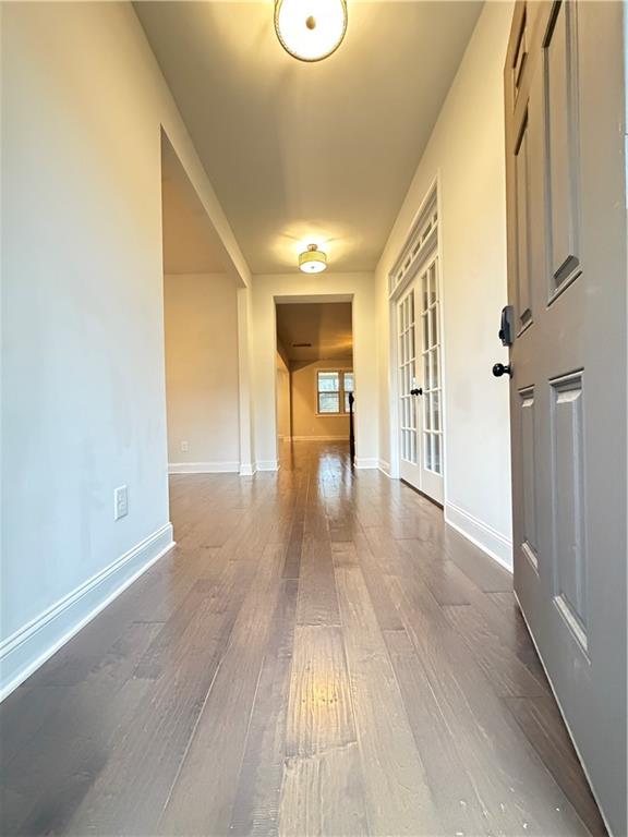 1545 Dahlia Drive Cumming, GA 30040 - Photo 5 of 50 a view of a hallway with wooden floor