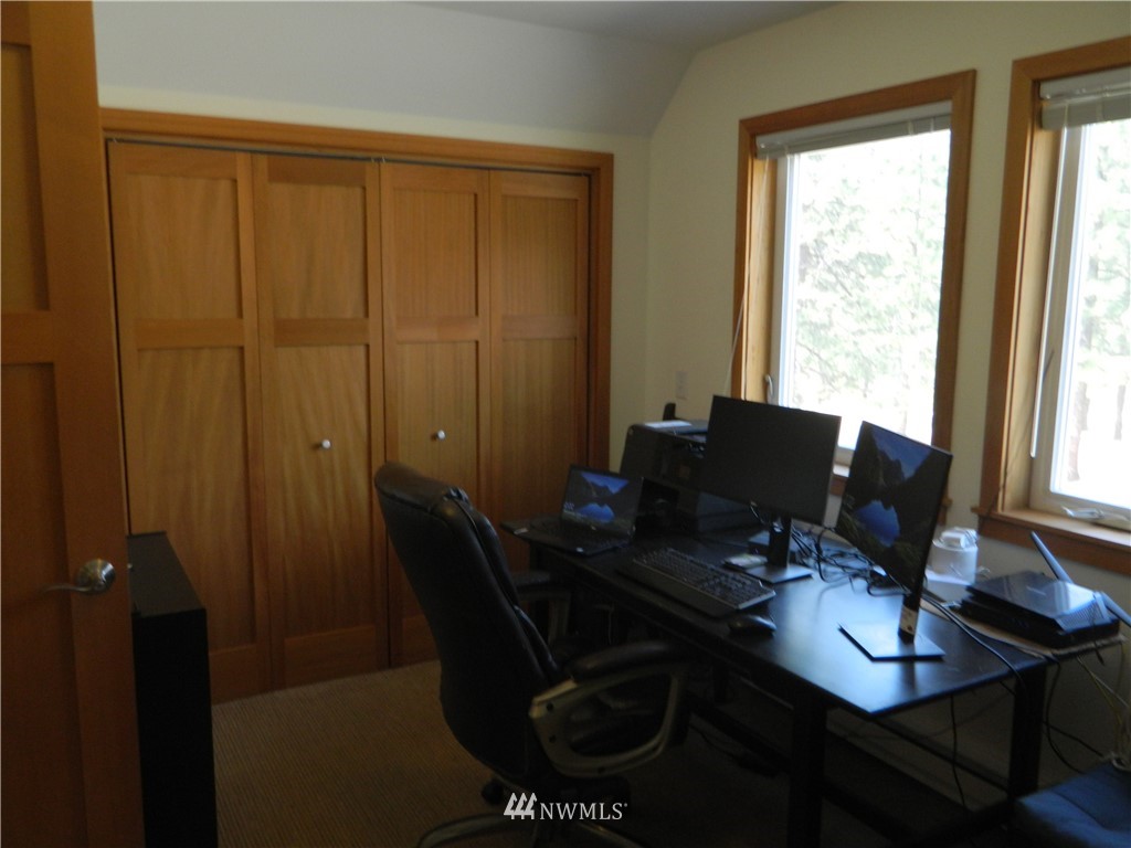 345 Neil Circle Road South Tonasket, WA 98855 - Photo 14 of 40 a view of a workspace with furniture and a window