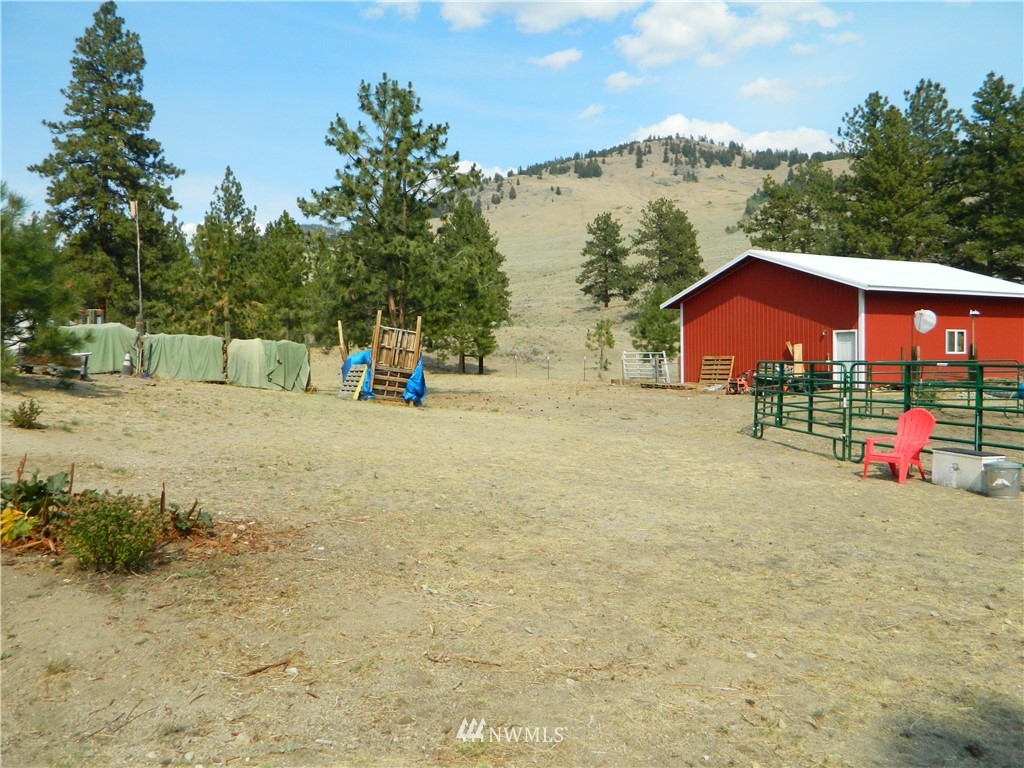 345 Neil Circle Road South Tonasket, WA 98855 - Photo 40 of 40 a view of a house with a yard and sitting area