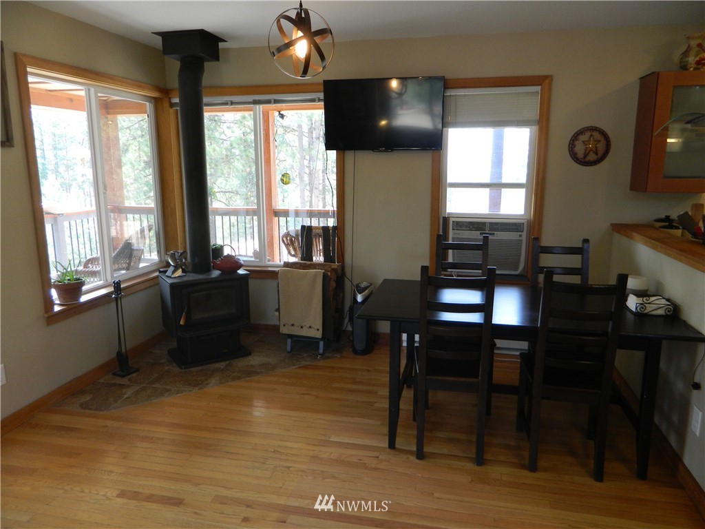 345 Neil Circle Road South Tonasket, WA 98855 - Photo 8 of 40 a view of a workspace with furniture and a window