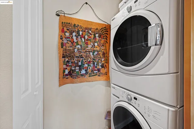 a kitchen with stainless steel appliances granite countertop a sink a stove and a wooden floors
