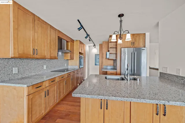 a bathroom with a sink a toilet and a shower
