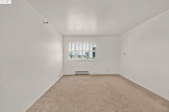 a bathroom with a granite countertop sink a shower and a mirror