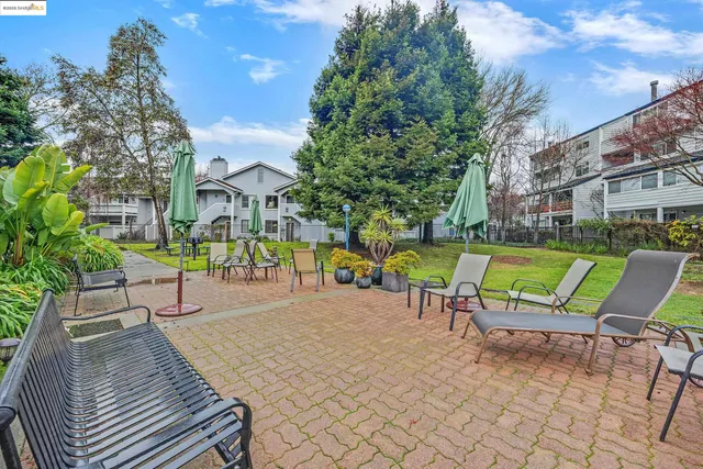 a kitchen with stainless steel appliances granite countertop a stove and cabinets