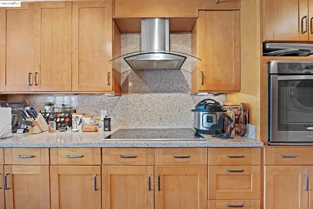 a living room with furniture a red lamp and a table