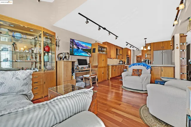 a bedroom with furniture and a book shelf