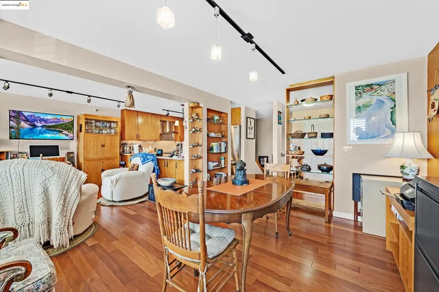 a bedroom with a bed and a book shelf