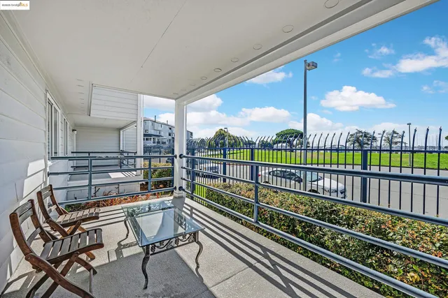 a view of balcony and wooden floor