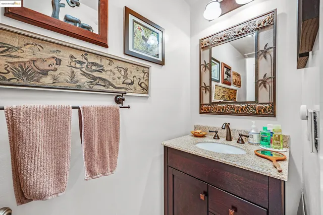a view of a living room with hardwood floor and a flat screen tv