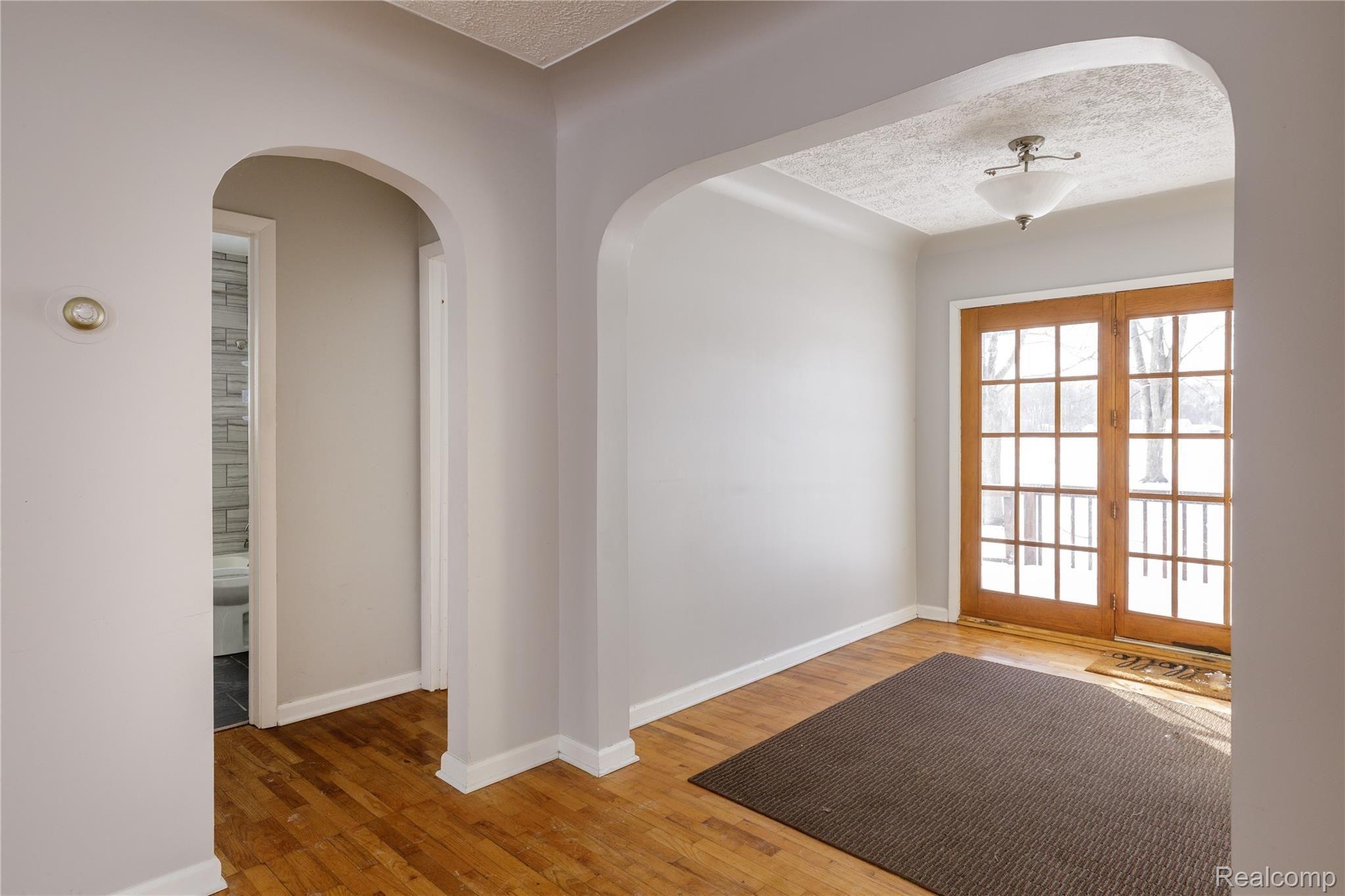4007 North Belsay Road Flint, MI 48506 - Photo 16 of 26 Formal dining room and hallway to 2 bedrooms