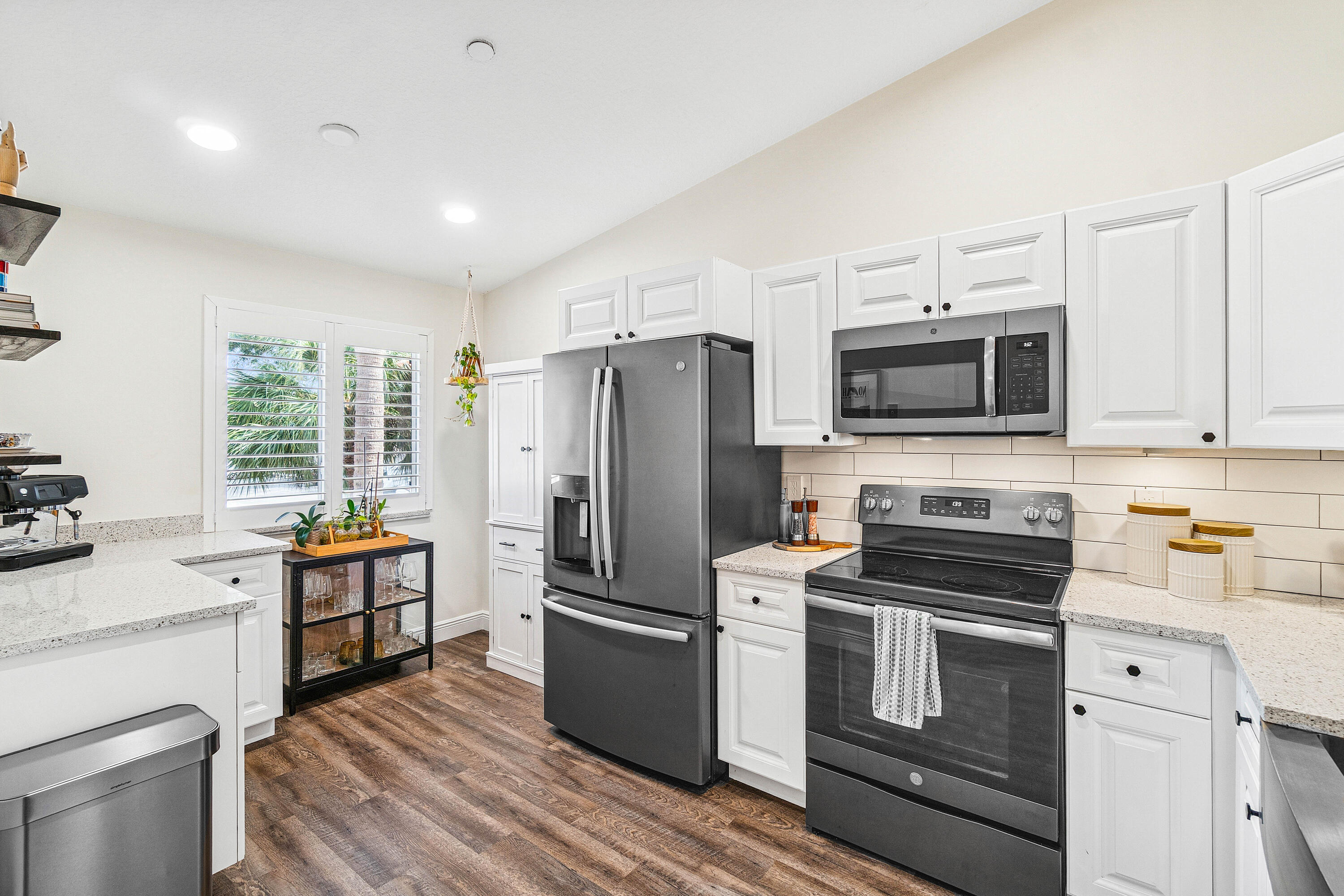 340 Northwest 67th Street, Unit 202 Boca Raton, FL 33487 - Photo 13 of 39 a kitchen with a refrigerator stove and microwave