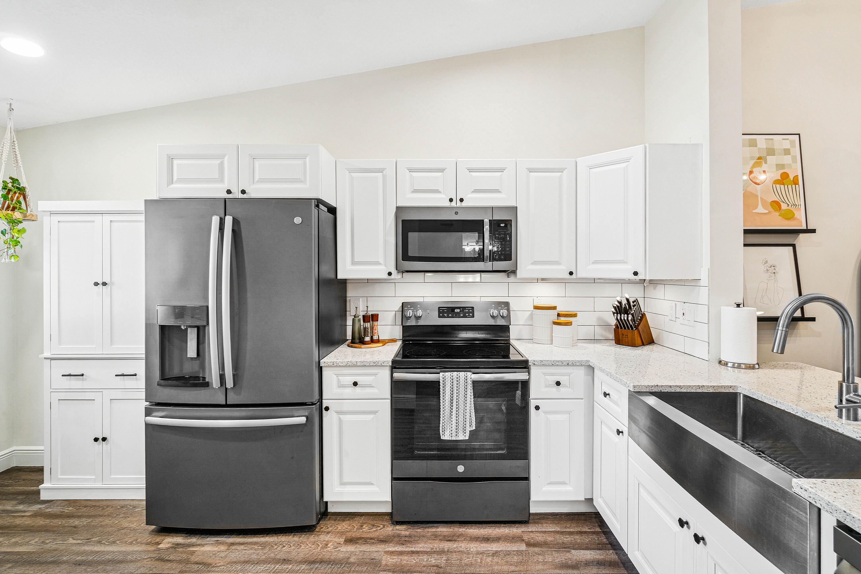 340 Northwest 67th Street, Unit 202 Boca Raton, FL 33487 - Photo 14 of 39 a kitchen with a refrigerator stove and sink