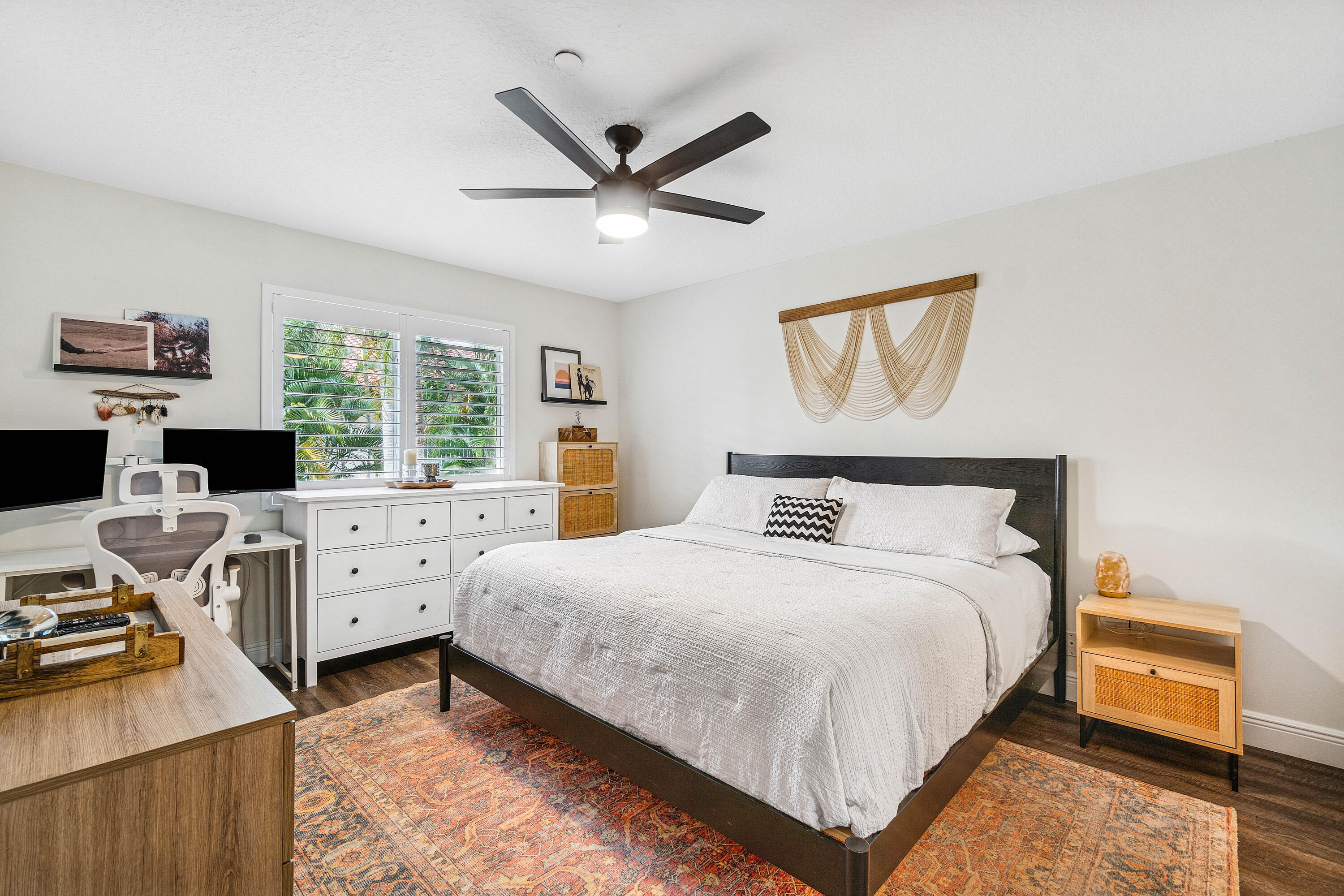 340 Northwest 67th Street, Unit 202 Boca Raton, FL 33487 - Photo 17 of 39 a bedroom with a bed and a desk