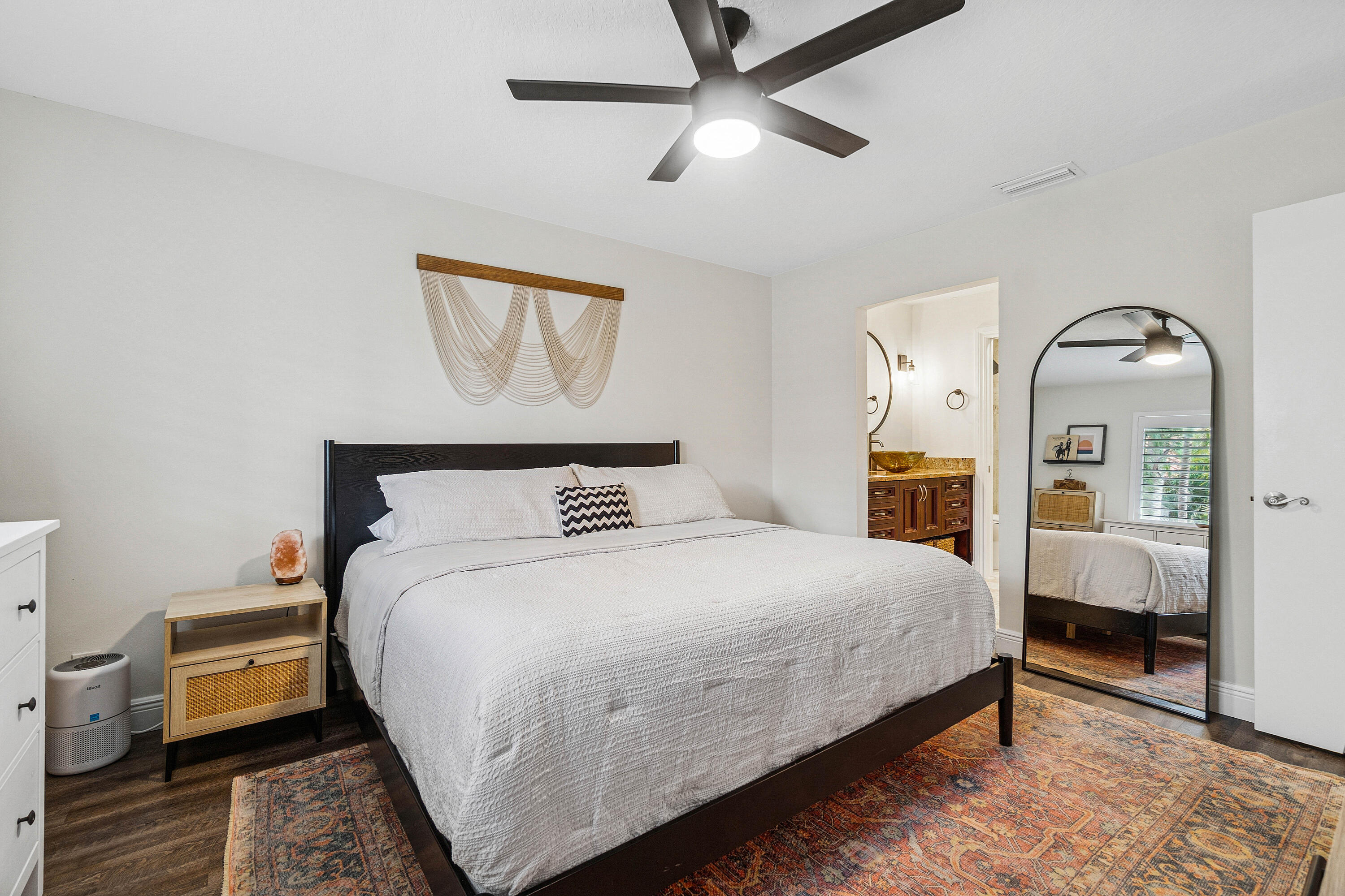 340 Northwest 67th Street, Unit 202 Boca Raton, FL 33487 - Photo 18 of 39 a bedroom with a bed and wooden floor