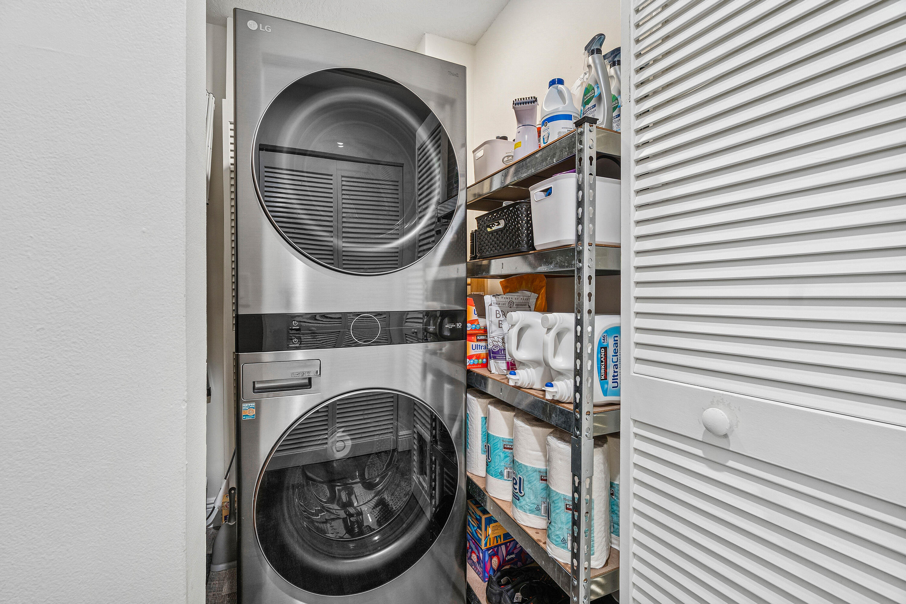 340 Northwest 67th Street, Unit 202 Boca Raton, FL 33487 - Photo 29 of 39 a utility room with dryer and washer