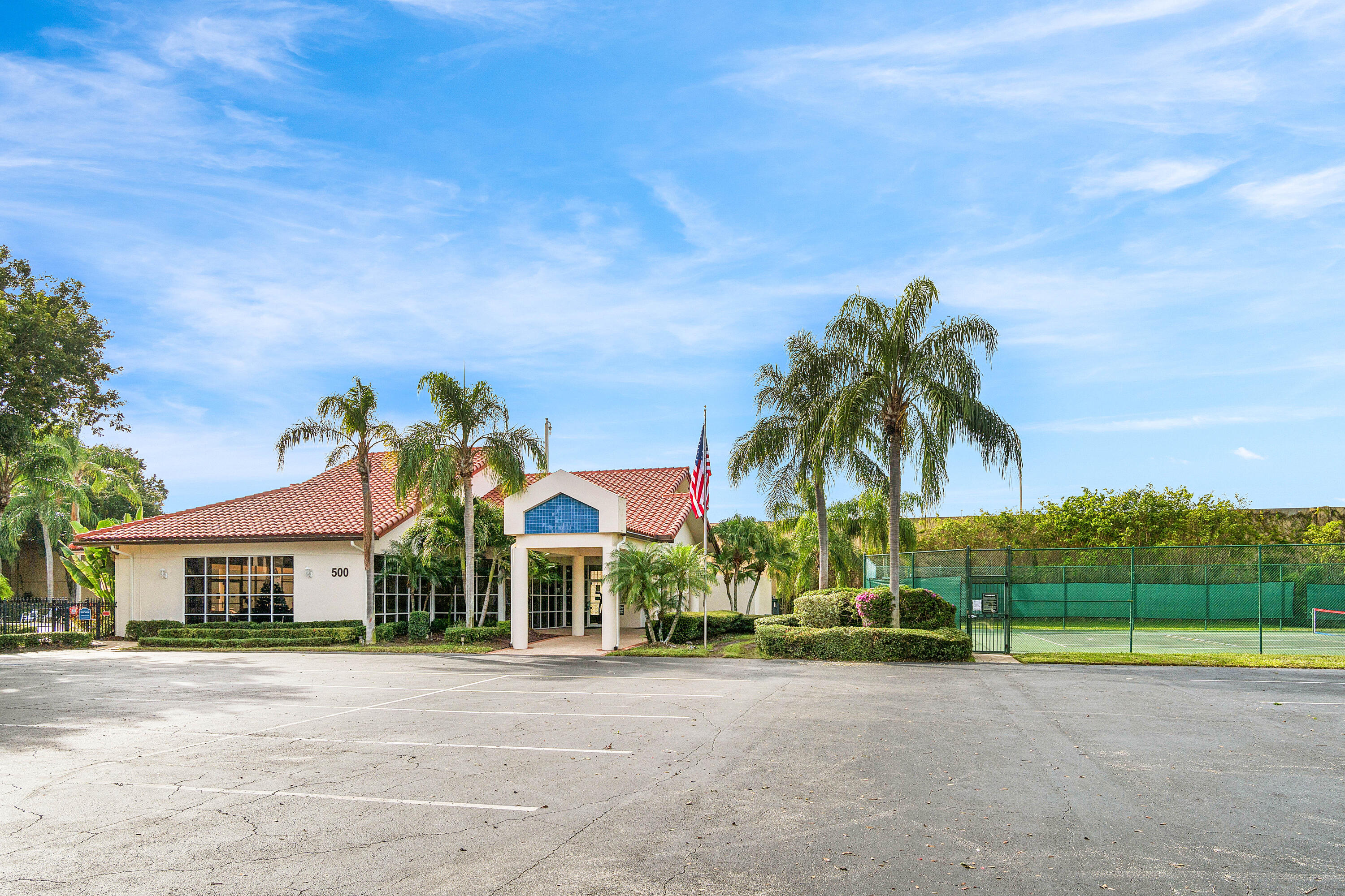 340 Northwest 67th Street, Unit 202 Boca Raton, FL 33487 - Photo 32 of 39 front view of house with palm trees