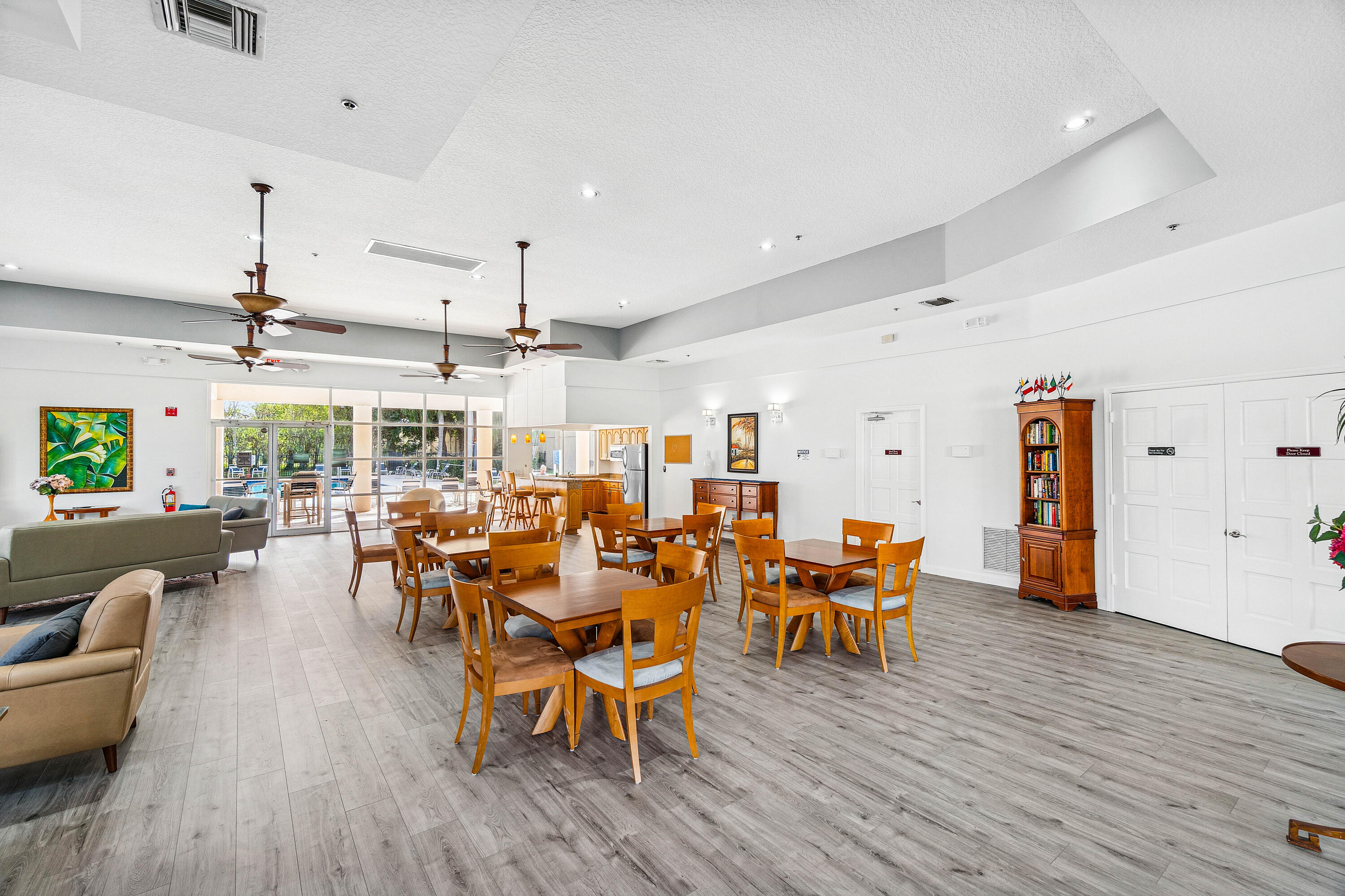 340 Northwest 67th Street, Unit 202 Boca Raton, FL 33487 - Photo 33 of 39 an outdoor space with furniture and wooden floor