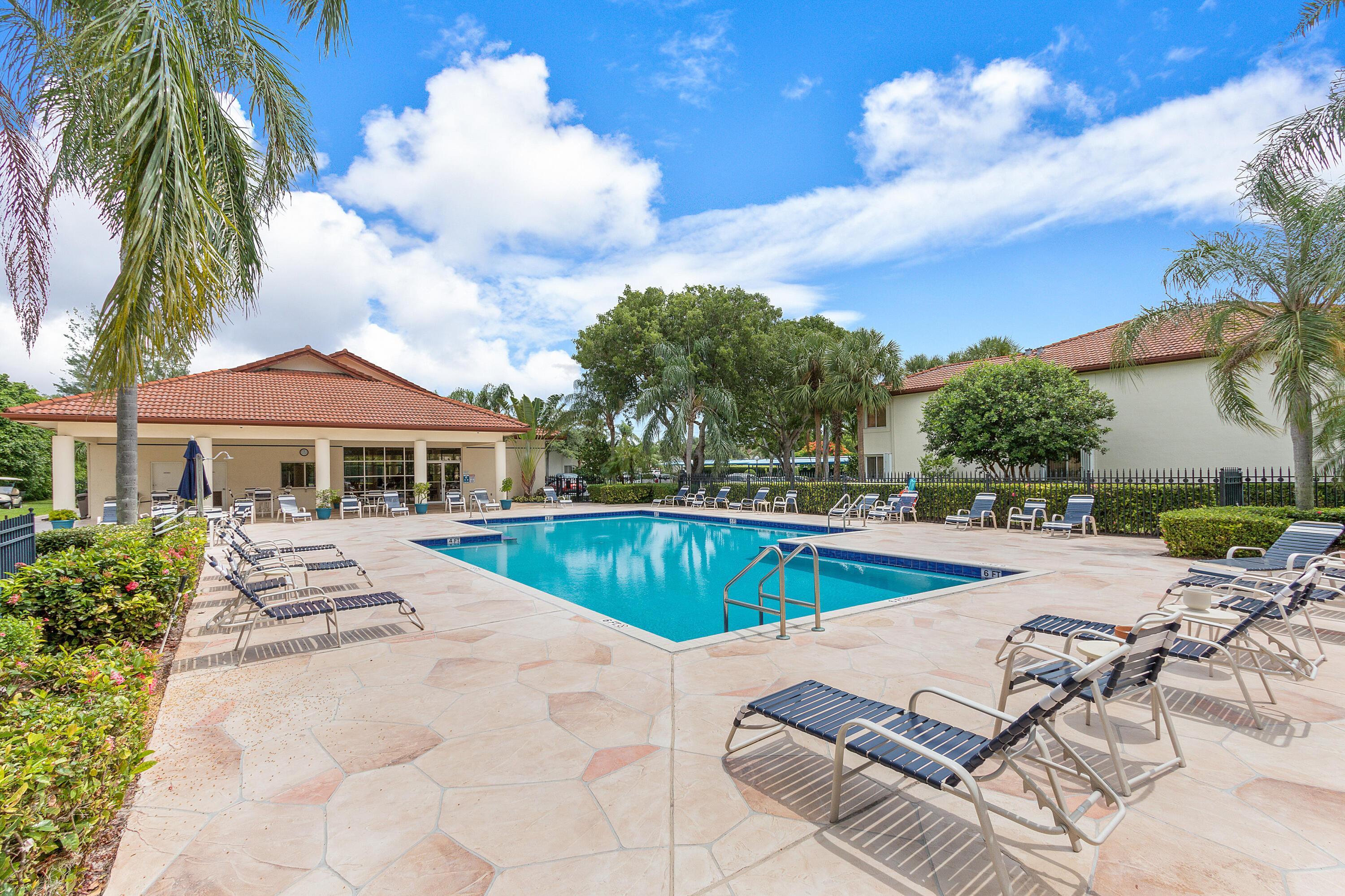 340 Northwest 67th Street, Unit 202 Boca Raton, FL 33487 - Photo 38 of 39 a view of a patio with swimming pool